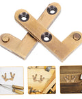2-Pack Heavy Duty Hidden Door Hinges For Secret Bookcase Doors Concealed Pivot Hinge With Bronze Finish Built Tough Durable Brass Construction Silent Smooth Swinging Motion Ideal For Hidden Cabinets And Modern Bookcase Projects, shown disassembled on a table with tools nearby.