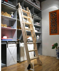 Wooden ladder in a library setup with Sliding Library Ladder Kit From 3.3Ft To 20Ft Track System With Round Tube Extension. Alt view.