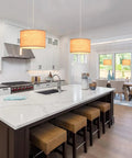 2 Pack Plug In Pendant Lights With 15Ft Clear Cord Toggle Switch Beige Linen Shade Modern Hanging Lamp over a kitchen island.