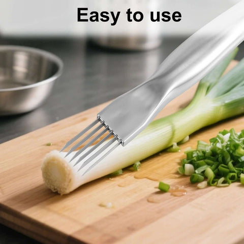 Front view of stainless steel multi-blade green onion crinkle cutter shredding scallions on cutting board
