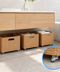 Three woven storage bins with Sweet Ride 8 Pack Mini Caster Wheels Half Inch Self Adhesive low profile smooth rollers underneath.