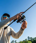 Person using 6 Ft 6 In Max SX Spinning Rod And Reel Combo Size 3000 With 7 Stainless Steel Ball Bearings Front Drag 24 Ton Graphite Rod