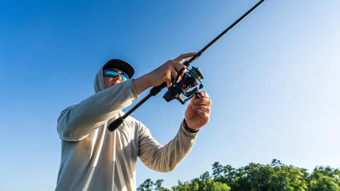 Person using 6 Ft 6 In Max SX Spinning Rod And Reel Combo Size 3000 With 7 Stainless Steel Ball Bearings Front Drag 24 Ton Graphite Rod