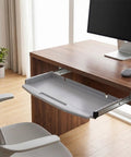 Heavy Duty Steel Under Desk Keyboard Tray Featuring Slick Ball Bearing Glides For Silky Smooth Extension And Rock Solid Ergonomic Workstation Support Up To Sixty Six Pounds With Zero Wobble Or Jamming Vibes slide out under desk with ergonomic design and gray finish.