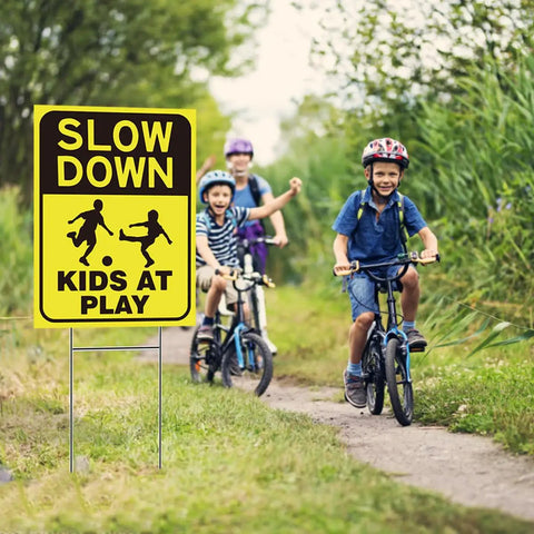 Two Pack Kids At Play Signs For Street With Metal Stakes Double Sided 16 By 12 Inch Children At Play Safety Signs installed on pathway