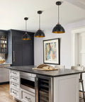 Kitchen island with Dope Industrial Modern Black Barn Pendant Lights Set Of 3, featuring metal dome shades in black and gold interior.