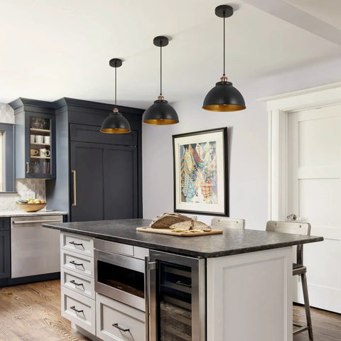 Kitchen island with Dope Industrial Modern Black Barn Pendant Lights Set Of 3, featuring metal dome shades in black and gold interior.