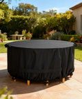 Round Outdoor Table And Chair Set Cover Fits 48 Inch Diameter By 28 Inch High Beefy Built 420D Waterproof UV Resistant Windproof Dustproof Black Patio Furniture Cover shown installed on patio set.