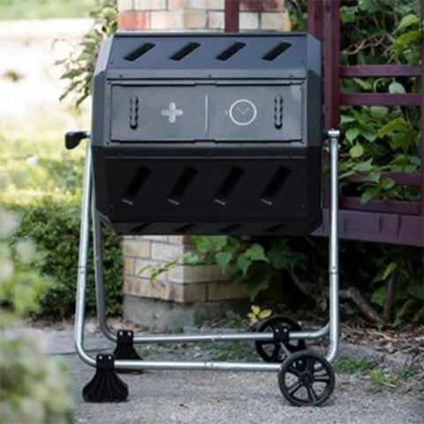 Dual Chamber Tumbling Compost Bin With Wheels, 37 Gallon Outdoor Garden Recycler, Elevated Rotating Bin For Easy Yard Composting, No Fuss Durable Plastic Black in garden setting