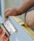 Installation of Stainless Steel Spring Door Hinges 3 Inch, 2 Pack Auto Close Double Swing Door Hardware on a wooden door.
