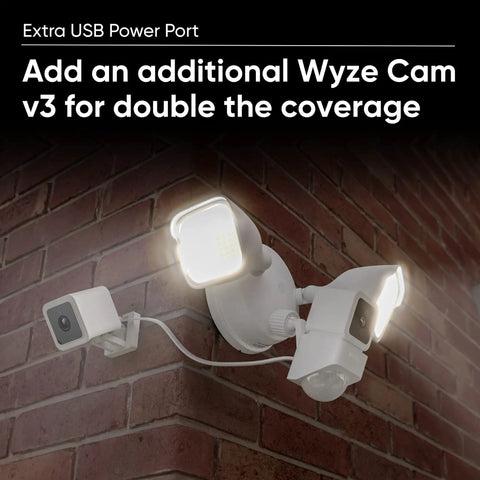 Smart Floodlight Security Camera with 2600 Lumens, 1080P HD mounted on brick wall with additional Wyze Cam v3.