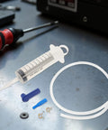 Beavorty Manual Fluid Extractor Pump Portable Plastic Transfer Kit For Car Oil Change With Dual Extraction And Filling Design Using Extension Tubes shows plastic syringe and tubes for fluid transfer.