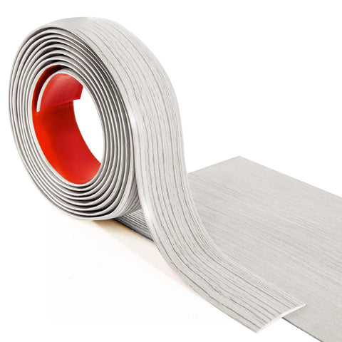 Self Adhesive Vinyl Floor Transition Strip For Laminate And Tile Floors A Flat Divider To Join Gaps And Create A Clean Carpet Threshold Look White Washed Four Feet Long One Point Five Seven Inch Wide Scratch Dirt Resistant Easy Peel And Stick rolled out with visible adhesive backing