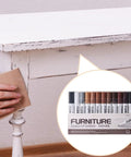 Close-up of 12 Color Wood Marker Set For Furniture Repair, covering scuffs on a white table with natural finish and quick concealment.