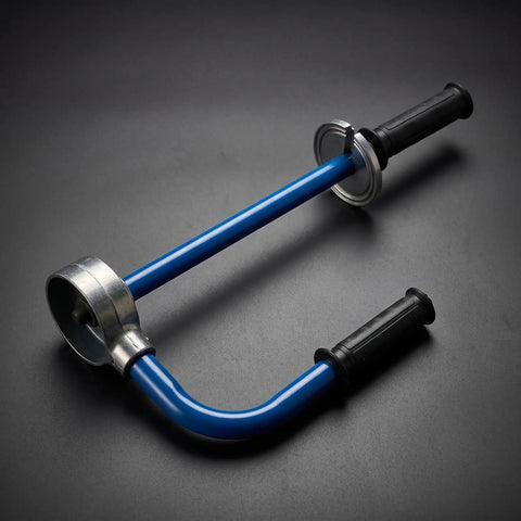 No Sweat Packing Heavy Duty Manual Stretch Film Dispenser Ergonomic Handheld Pallet Wrap Tool with knuckle saving grips on black surface.