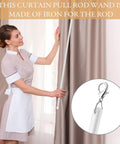 Model using No Sweat Curtain Pull Wands 46 Inch White Acrylic Drapery Rod Openers with hooks, adjusting curtains at home.