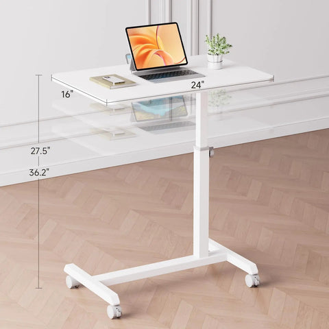 Mobile Standing Desk On Wheels, Sit Stand Laptop Table With Lockable Casters, Adjustable 7 Level Height From 27.5 To 36.2 Inches, Portable Overbed Bedside Workstation, White, displaying books and a plant.