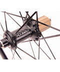 Close-up of carbon hub on Ultralight 700C Road Bike Wheelset With Carbon Hub For Climbing Beasts 2 To 1 Spoke Ratio V Brake Quick Release.