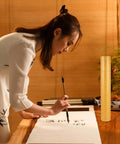 Yellow Poster Mailer Tube With Spacious Interior And Waterproof Design For Art Supplies next to an artist painting