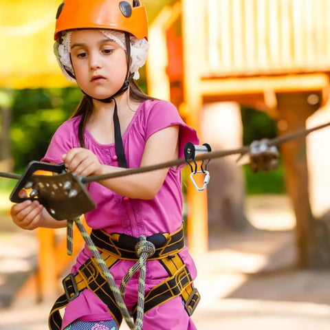 Child using Slackline Pulley Kit for Backyard Zipline and Slackline Heavy Duty Rope Pulley System with Low Friction Slider Iron Construction Safe 50kg Load Easy Install for Kids and Teens Durable Outdoor Play Accessory.