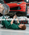 Mechanic using Heavy Duty Nylon Cable Tie Buckle Kit With Pin And Button, UV Resistant Black Zip Ties For Car Repairs on a car underbody