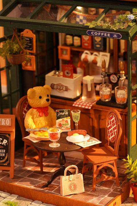 Charming Bistro Style Miniature House Kit With LED For Adults Beginners DIY Wooden Dollhouse Cozy Cafe Vibe Perfect Mother's Day Or Birthday Gift 9.37 By 7.09 By 7.17 Inches, featuring a cozy bistro scene with teddy bear and tiny cafe elements.