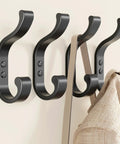 Heavy Duty Wall Mount Coat Hooks Set Of 4, Each Holds Up To 30 Lbs, Wide, Rugged Hanger Hooks For Coats, Backpacks, Towels, Purses, And Clothes, Great For Mudroom, Hallway, Bathroom, Or Door, Rust Resistant Black Finish shown with bag