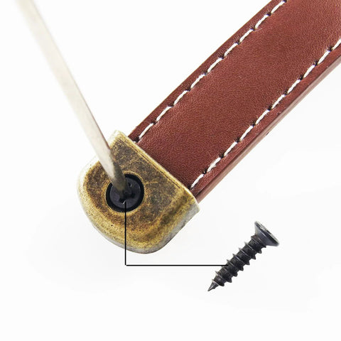 Close-up of Brown Box Leather Handles 6 Pack for Furniture Cabinets and Drawers Vintage Antique Style Pulls with included screws.
