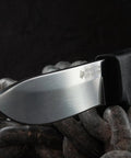 Close-up of Pendleton Lite Hunter Fixed Blade Knife, 3.625-Inch Drop Point, German 4116 Stainless Steel blade on a chain.