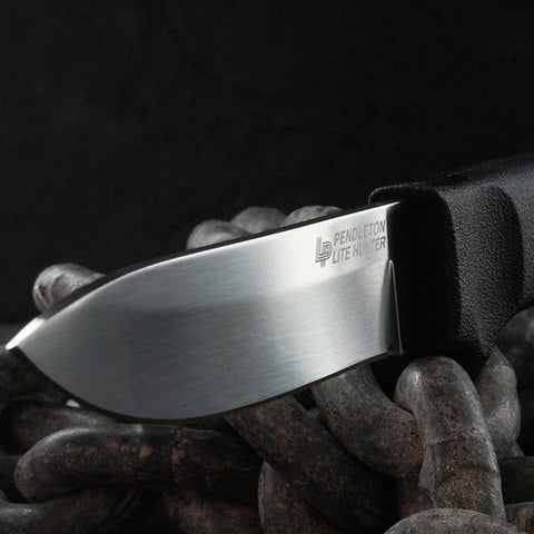 Close-up of Pendleton Lite Hunter Fixed Blade Knife, 3.625-Inch Drop Point, German 4116 Stainless Steel blade on a chain.