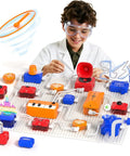 Child experimenting with Kids Electronics Exploration Kit With Over 671 Circuit Projects And Physics Experiments, wearing goggles.