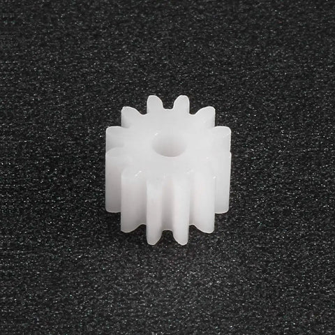 Close-up of a white plastic gear, 12-tooth, part of 40 Piece Plastic Gear Set With 12 Tooth Model 122A Reduction Worm Gears.