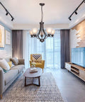 Living room with 5 Light Shaded Contemporary Chandelier with Alabaster Glass in Oil Rubbed Bronze finish for modern lighting.