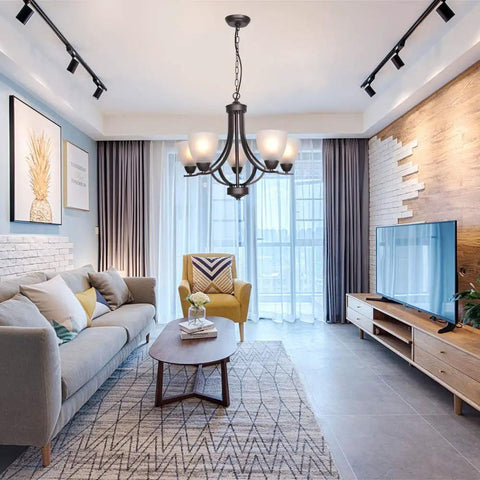 Living room with 5 Light Shaded Contemporary Chandelier with Alabaster Glass in Oil Rubbed Bronze finish for modern lighting.