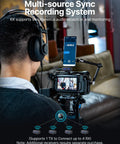 User recording with Wireless Lavalier Microphone System With AI Noise Cancellation on camera and phone setup.