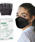 Woman wearing KN95 Face Masks For Adults 50 Pack Individually Wrapped 5 Ply Black Disposable Masks Against PM 2 5 Smoke And Dust With 95 Percent Filtration Efficiency And 3D Shape For Tight Fit And Easier Breathing In Everyday Use with packaging and individually wrapped black masks shown.