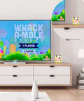 Sweet Soft Silicone Case for Nex Playground Game System on shelf beside TV, featuring colorful milk cow print, perfect for gaming.