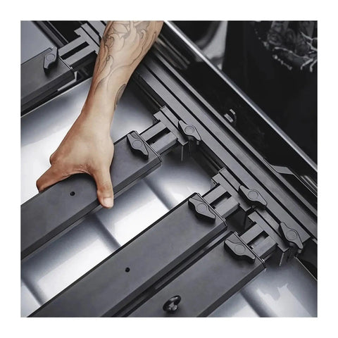 Installation of Heavy Duty Aero Roof Rack Built For Land Rover Defender 110 with secure locking mechanism and supportive bars.