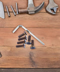 Steering Wheel Screw Kit M5 Aluminum Bolts With Hex Socket Wrench on wooden surface