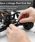 Close-up installation of Traxxas 30 Pcs RC Linkage Rod Ends For One Tenth Scale TRX-4 Crawler Upgrade High Precision M4 Ball Joint Heads