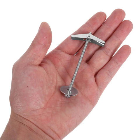Hand holding Heavy Duty Toggle Bolts And Wing Nuts Wall Anchor Kit For Hollow Walls And Ceilings, Carbon Steel 15 Sets.
