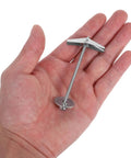 Heavy Duty Toggle Bolts And Wing Nut Kit For Drywall And Wood Panels Wall Anchors shown in a hand for scale