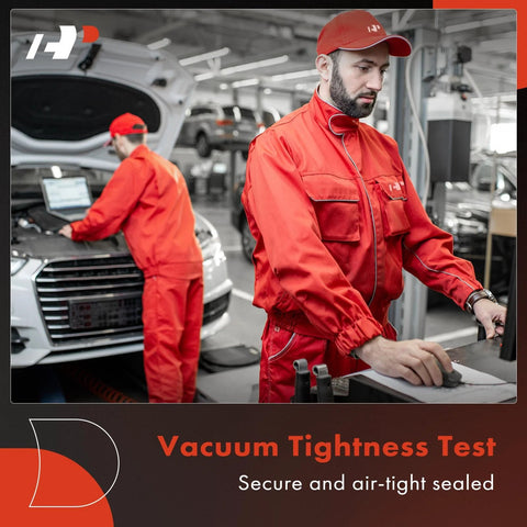 Mechanics in red uniforms performing vacuum tightness test on car in workshop