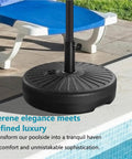 Rock Solid Heavy Duty Round Umbrella Base 85.7 Pound Water And Sand Filled Patio Stand next to a pool with lounge chair