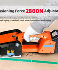 Heavy Duty Portable Banding Tool Featuring Automatic Hot Weld Tech For A Rock Solid Grip And No Sweat Setup Harnessing 2800 Newtons Of Tension, orange and black design, used for packaging