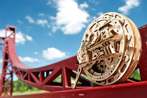 Mechanical Monowheel 3D Puzzle Kit Unicycle Style Wooden Steampunk Build For Adults Self Rolling Brain Teaser Model Kit Made Of Wood Family Friendly Craft Set Hands On Fun And Mental Challenge wooden monowheel on red bridge