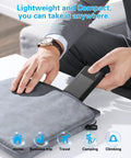 A person placing a Two Pack 10000mAh Portable Charger Power Bank With Dual USB Ports into a sleek pouch for travel use.