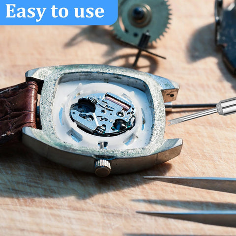 Watch repair kit with 360 steel spring bar pins (8–25 mm, 1.5 mm dia) and precision tools next to an open metal watch case with leather strap