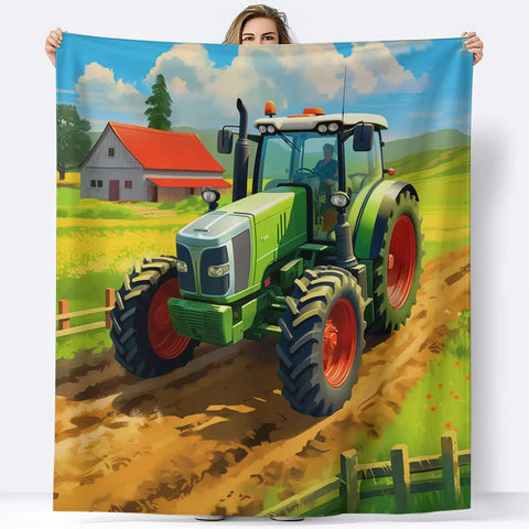 Ultra Cozy Lightweight Flannel Throw Blanket with a tractor and barn scene, 50 by 60 inches, held by a person, vibrant colors