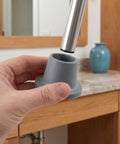 Heavy Duty Rubber Replacement Feet For Bath Chairs And Shower Benches Non Slip Grip 28.5mm Hole being installed by hand